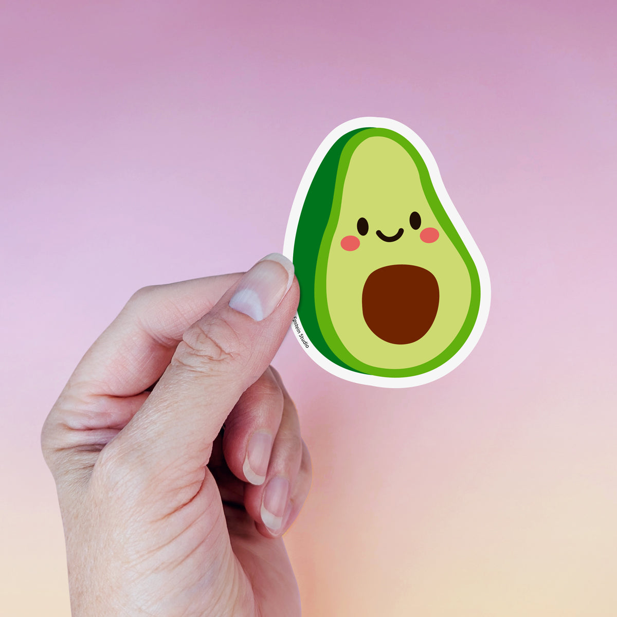 Kawaii avocado die-cut vinyl sticker by Sarah Epstein Studio.