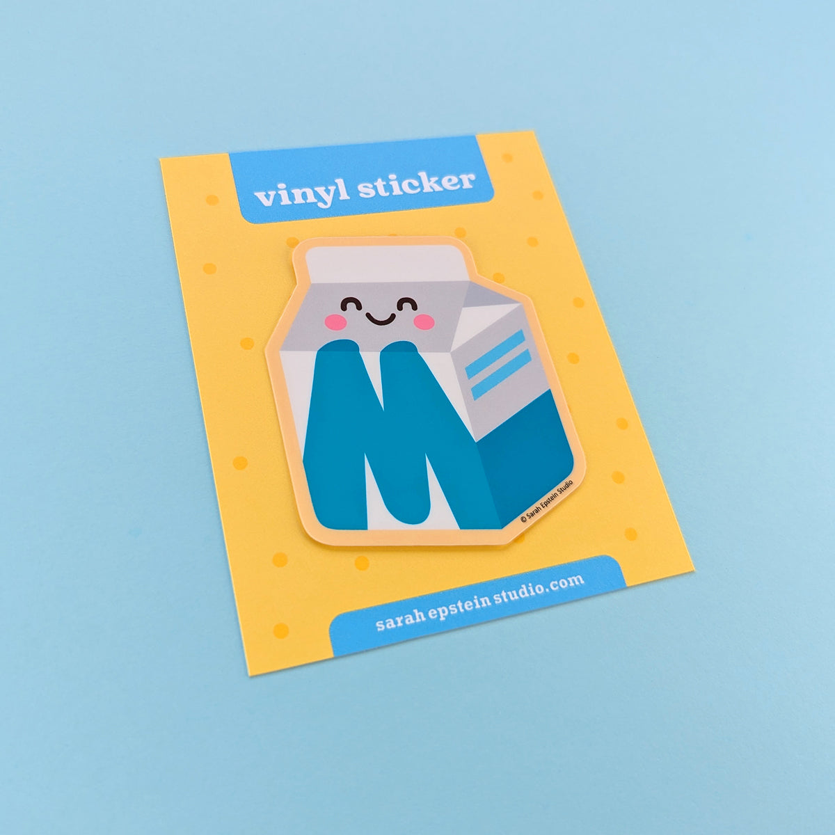 Kawaii Big M die-cut vinyl sticker by Sarah Epstein Studio.