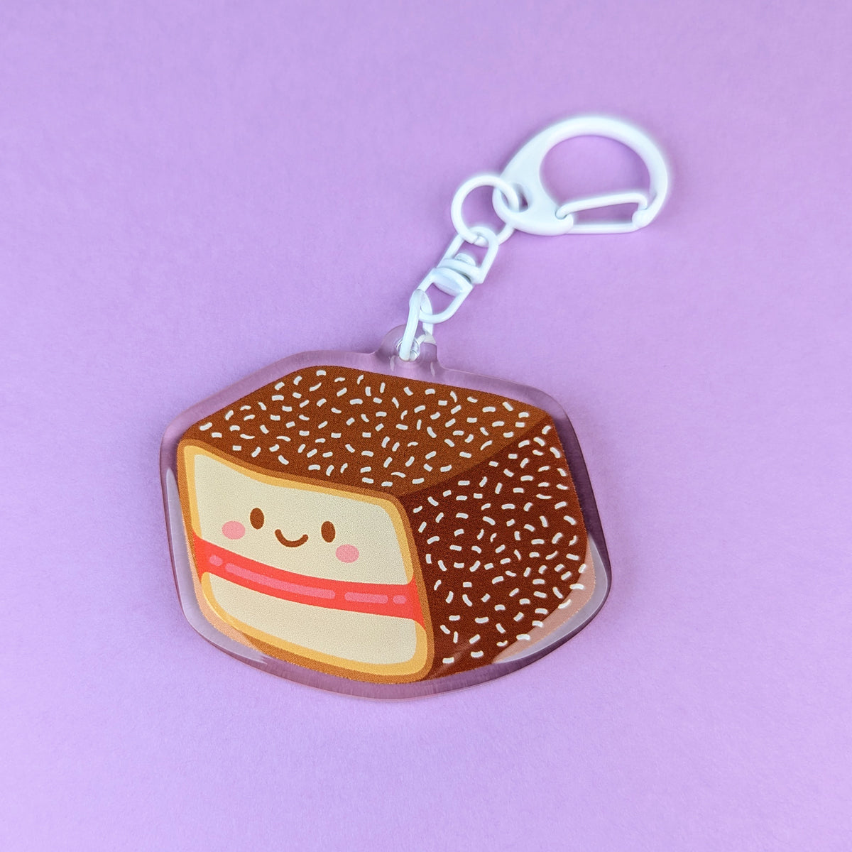 Kawaii lamington acrylic keychain by Sarah Epstein Studio.
