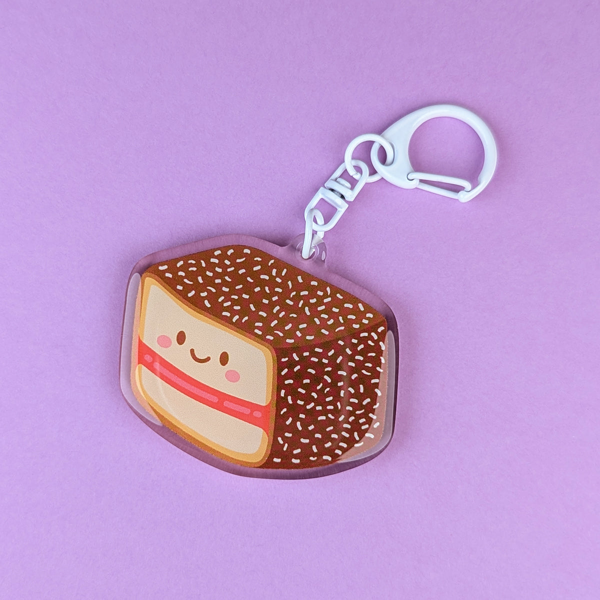 Kawaii lamington acrylic keychain by Sarah Epstein Studio.