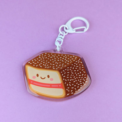 Kawaii lamington acrylic keychain by Sarah Epstein Studio.