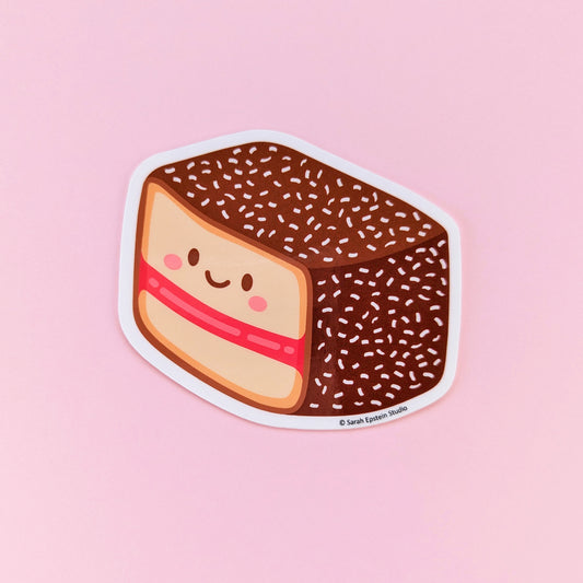 Kawaii lamington die-cut vinyl sticker by Sarah Epstein Studio.