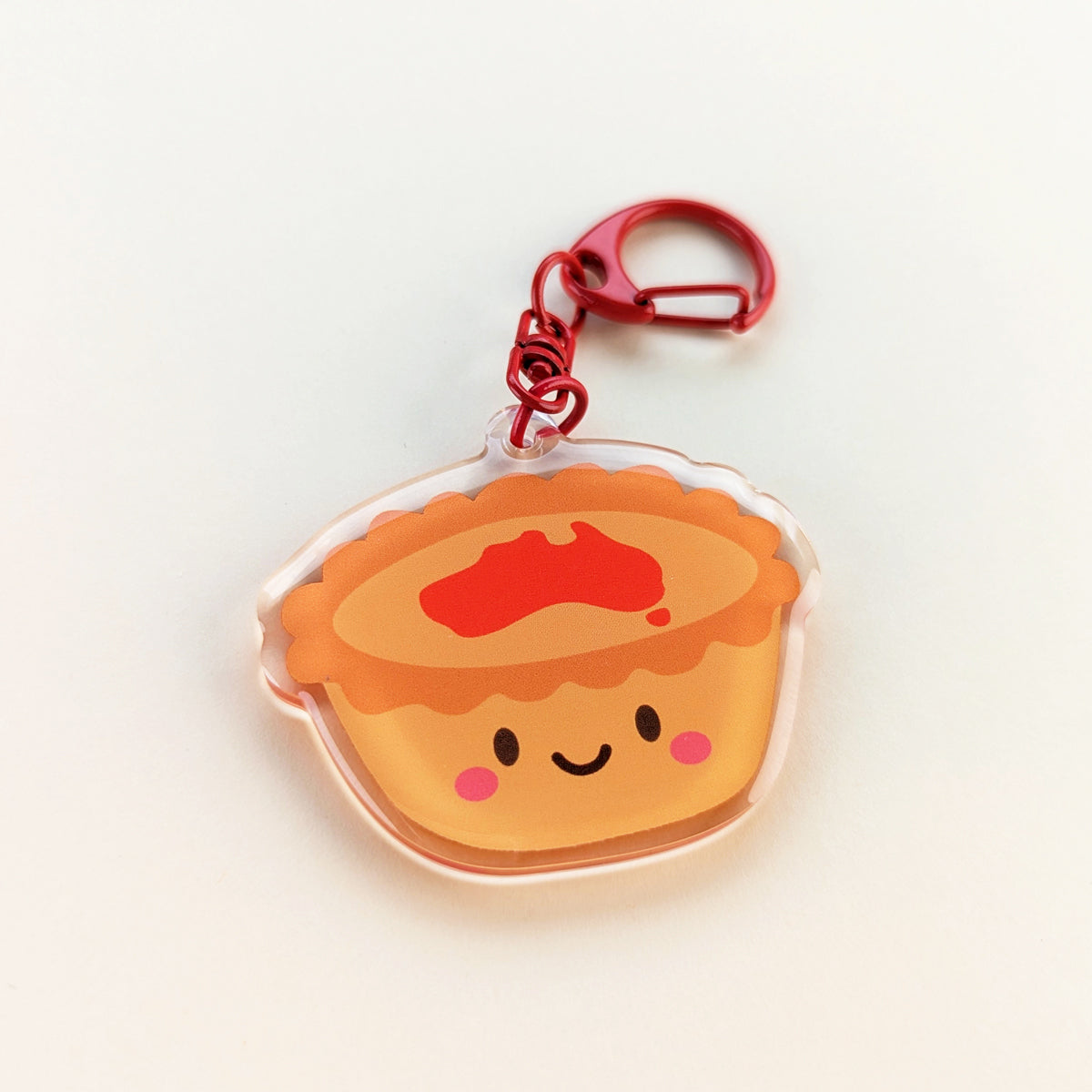 Kawaii meat pie acrylic keychain by Sarah Epstein Studio.