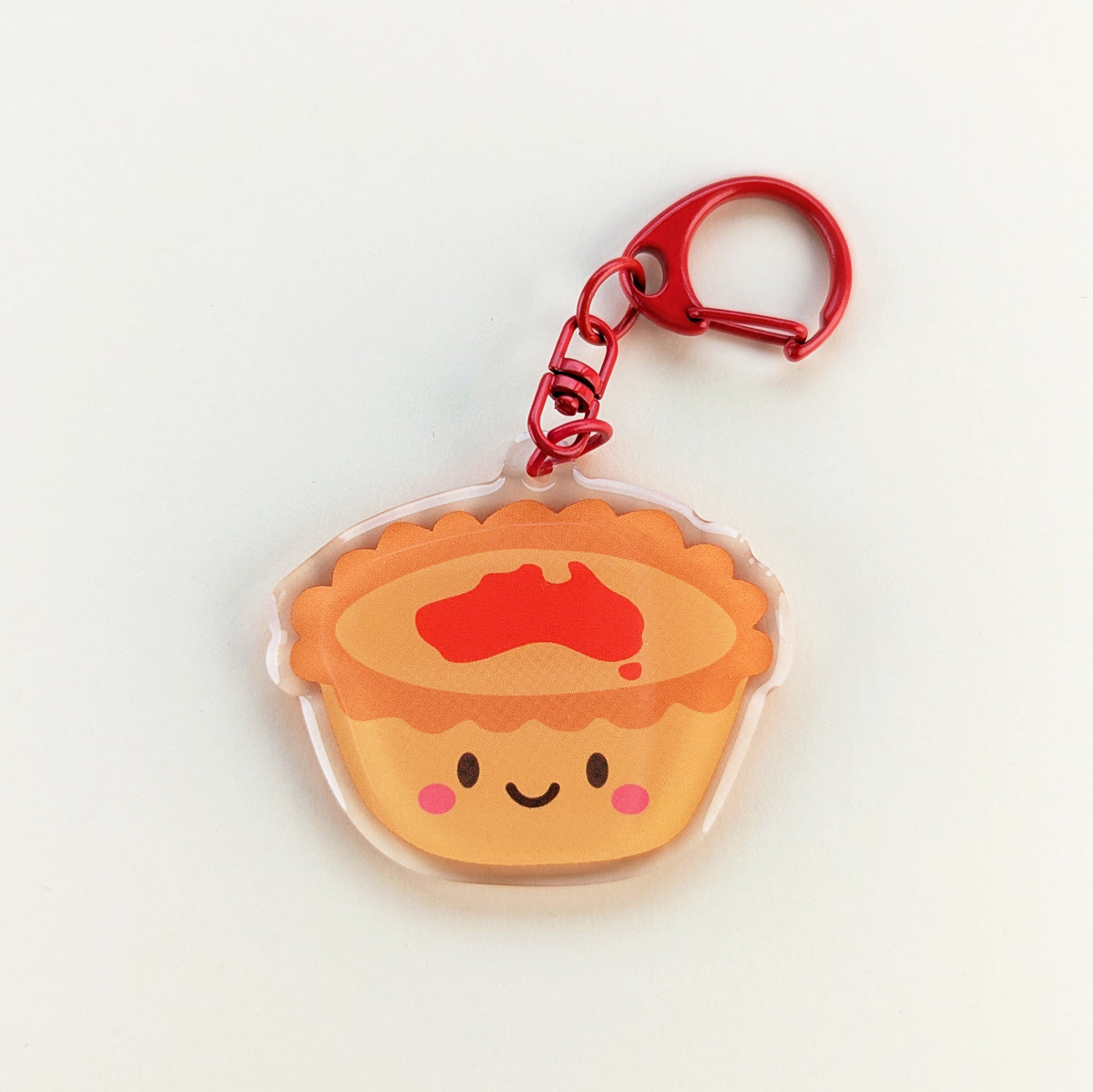Kawaii meat pie acrylic keychain by Sarah Epstein Studio.