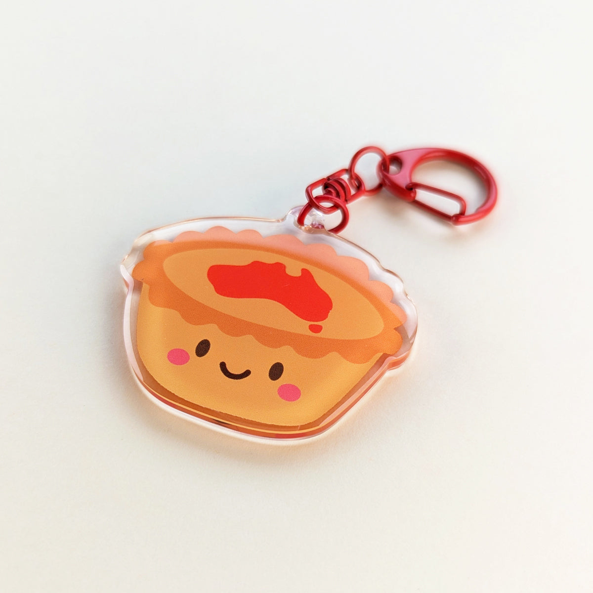 Kawaii meat pie acrylic keychain by Sarah Epstein Studio.