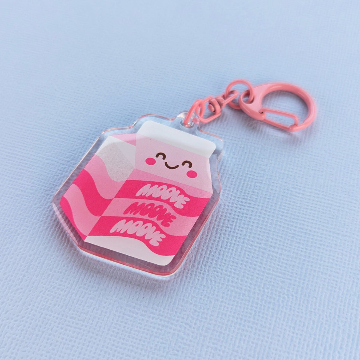 Kawaii Moove milk acrylic keychain by Sarah Epstein Studio.