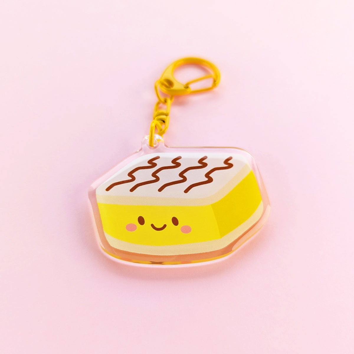 Kawaii vanilla slice acrylic keychain by Sarah Epstein Studio.