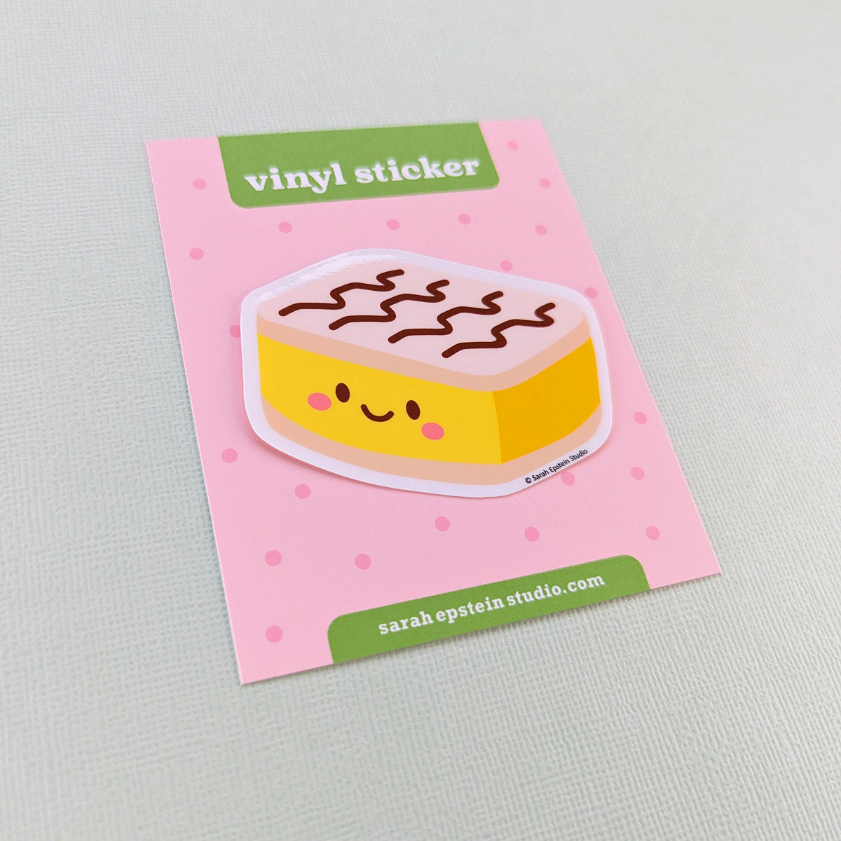 Kawaii vanilla slice die-cut vinyl sticker by Sarah Epstein Studio.