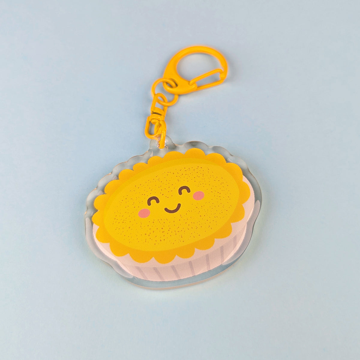 Kawaii custard tart acrylic keychain by Sarah Epstein Studio.