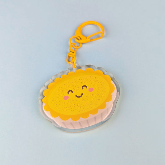 Kawaii custard tart acrylic keychain by Sarah Epstein Studio.