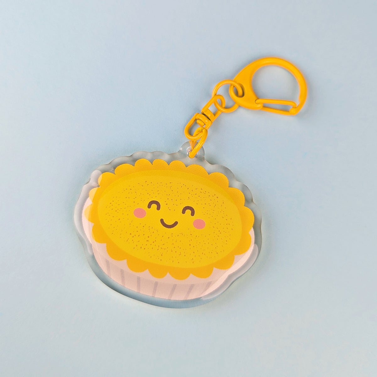 Kawaii custard tart acrylic keychain by Sarah Epstein Studio.
