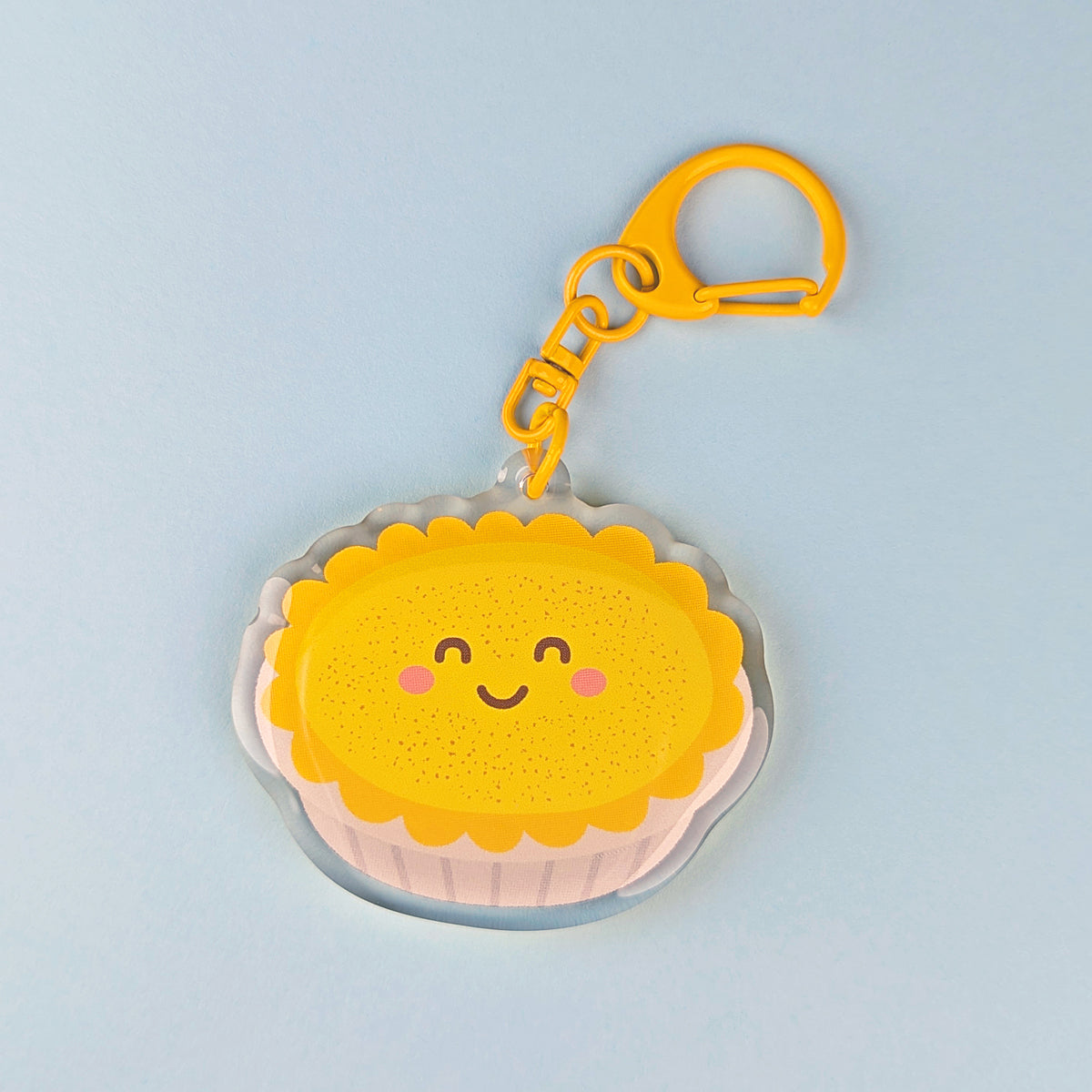 Kawaii custard tart acrylic keychain by Sarah Epstein Studio.
