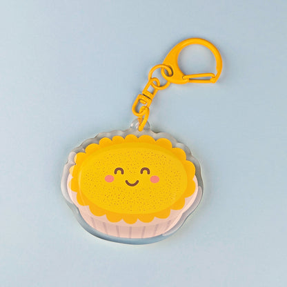 Kawaii custard tart acrylic keychain by Sarah Epstein Studio.
