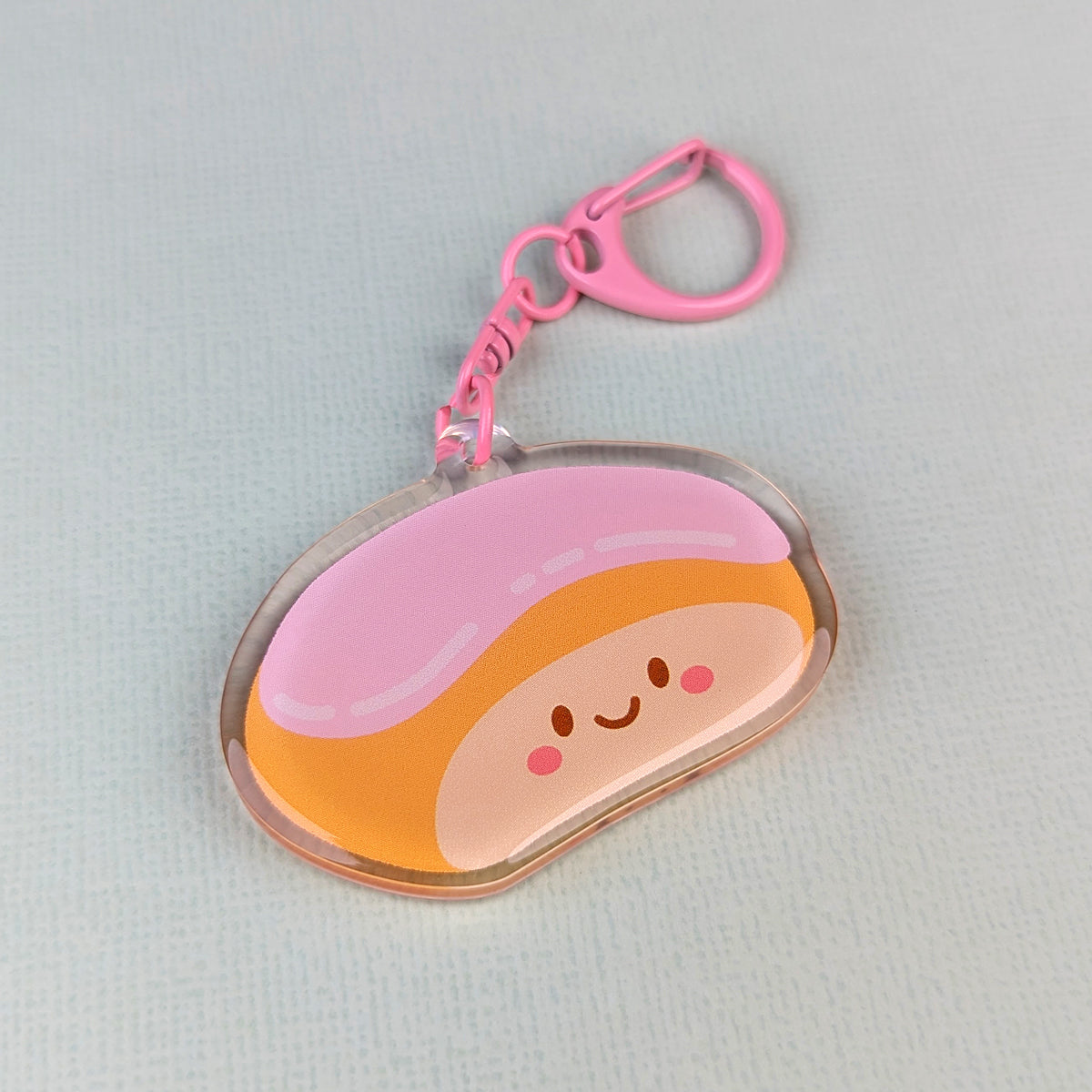 Kawaii finger bun acrylic keychain by Sarah Epstein Studio.