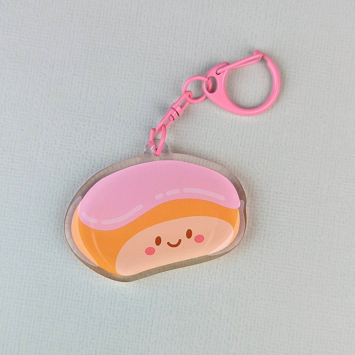 Kawaii finger bun acrylic keychain by Sarah Epstein Studio.