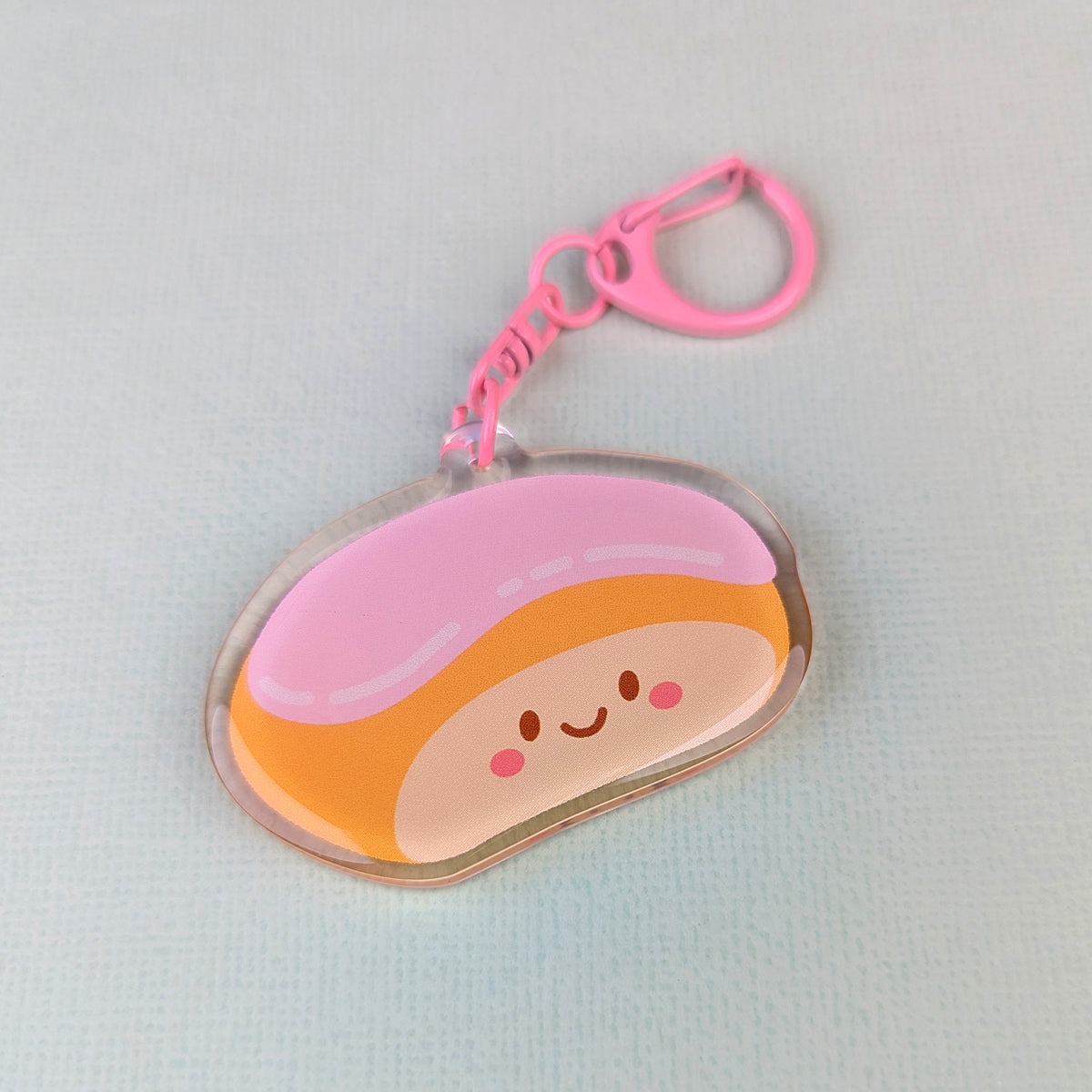 Kawaii finger bun acrylic keychain by Sarah Epstein Studio.