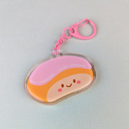 Kawaii finger bun acrylic keychain by Sarah Epstein Studio.
