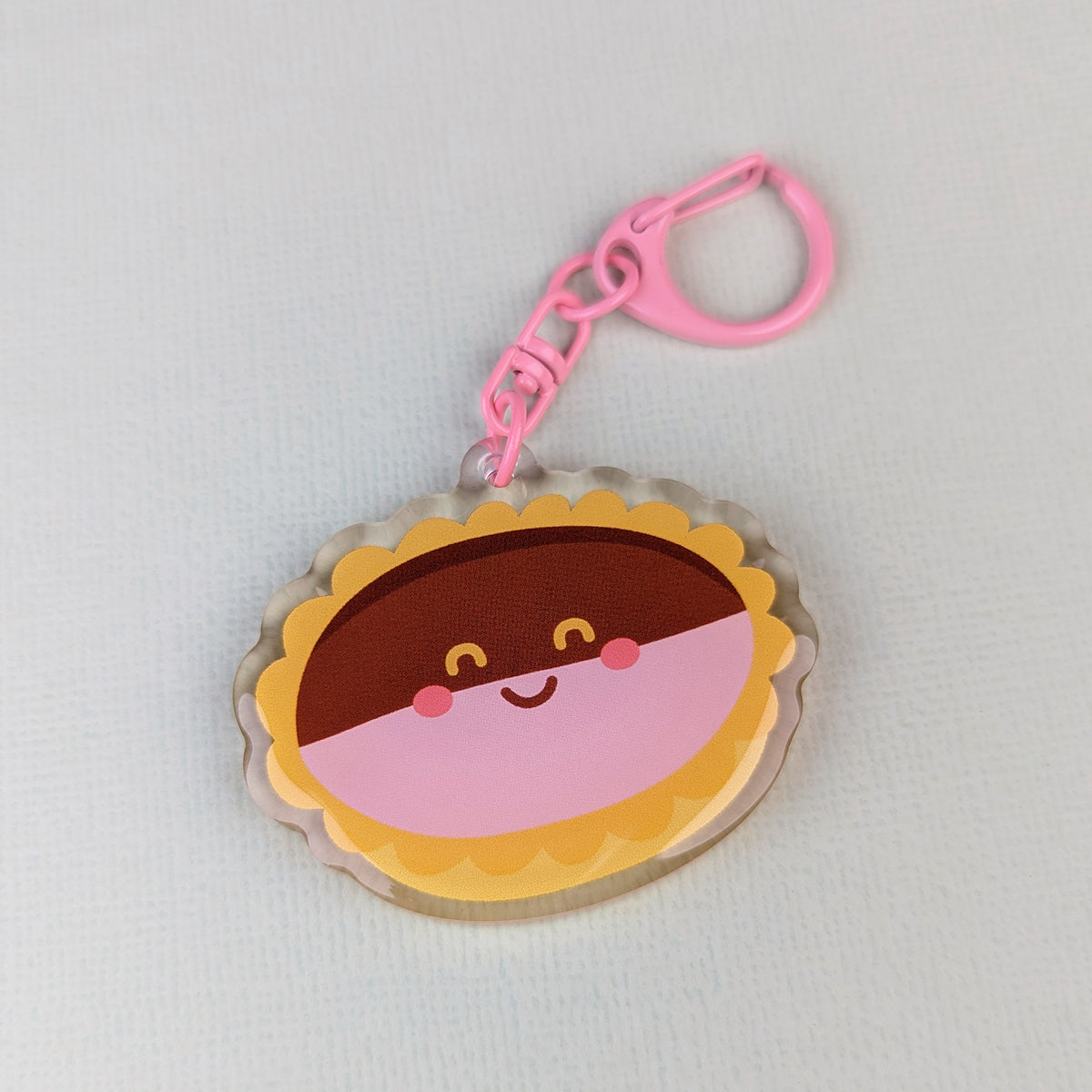 Kawaii neenish tart acrylic keychain by Sarah Epstein Studio.
