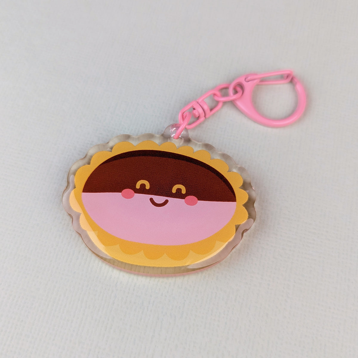 Kawaii neenish tart acrylic keychain by Sarah Epstein Studio.