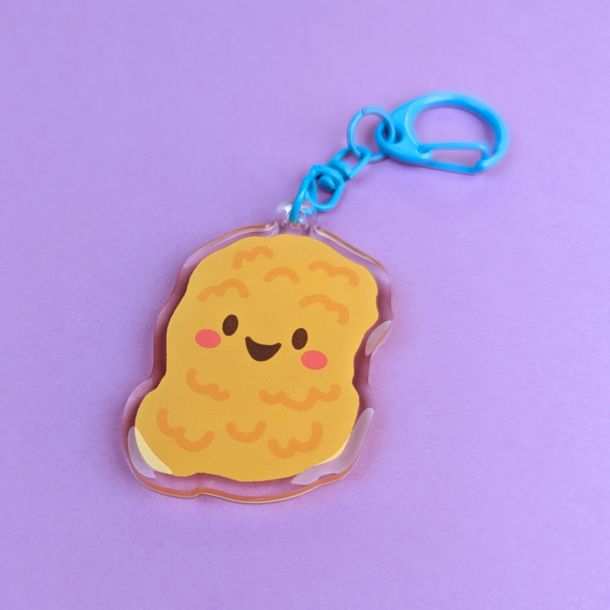 Kawaii Chicken Nugget acrylic keychain by Sarah Epstein Studio.