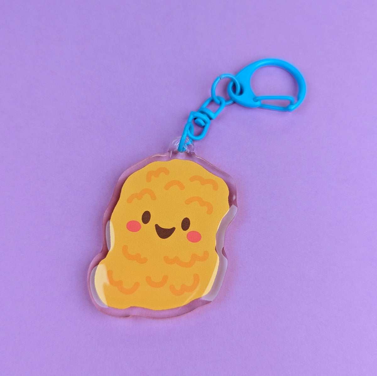 Kawaii Chicken Nugget acrylic keychain by Sarah Epstein Studio.