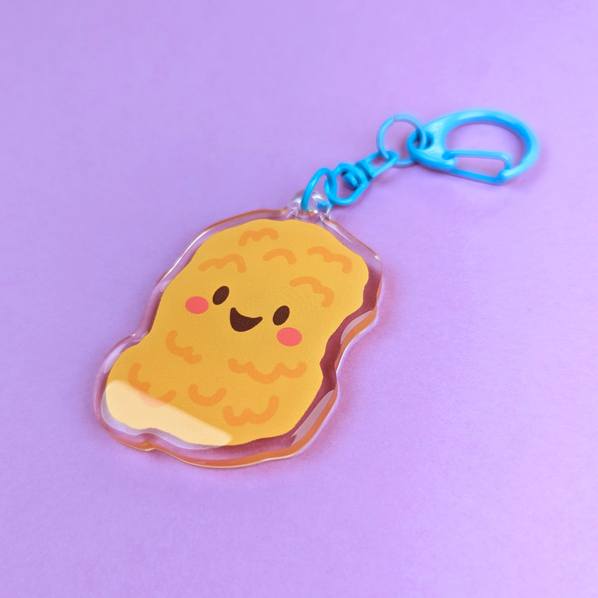 Kawaii Chicken Nugget acrylic keychain by Sarah Epstein Studio.