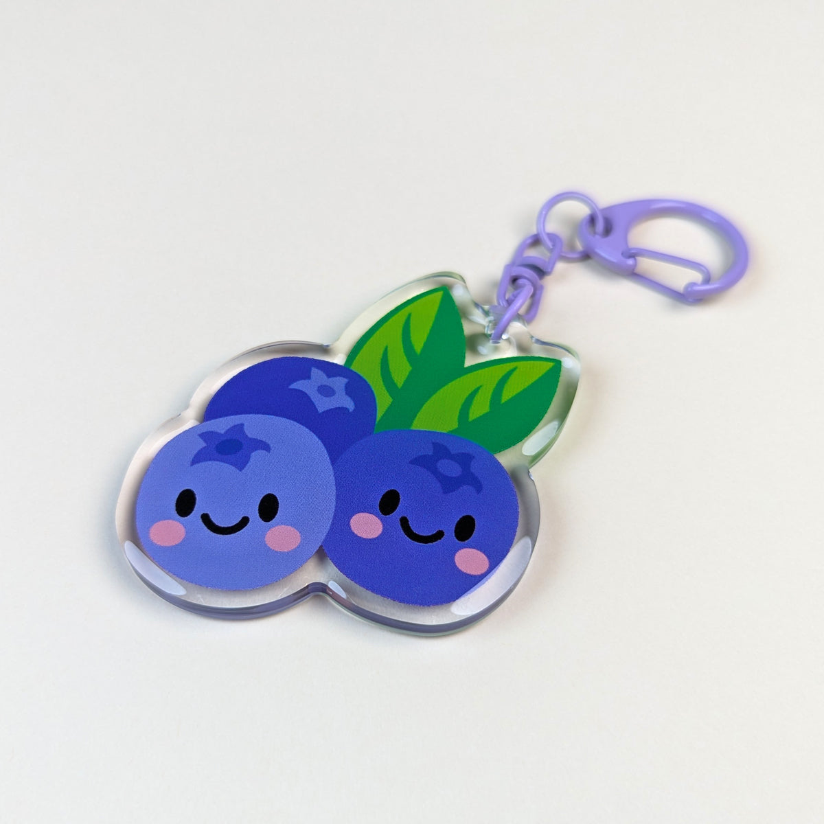 Kawaii Blueberries acrylic keychain by Sarah Epstein Studio.