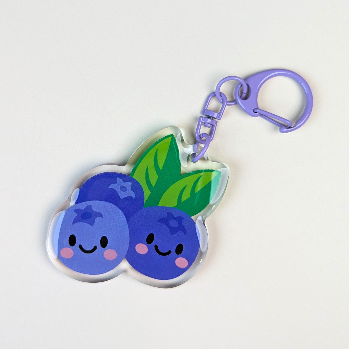Kawaii Blueberries acrylic keychain by Sarah Epstein Studio.